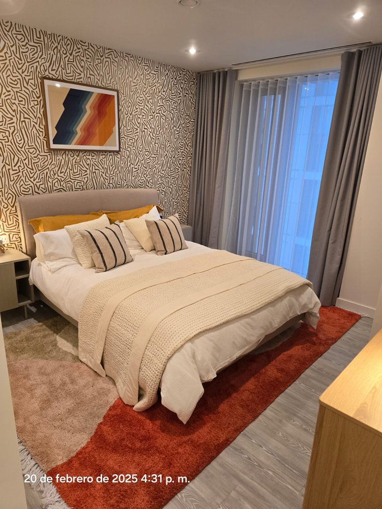 Freshly cleaned and prepared bedroom in a London apartment